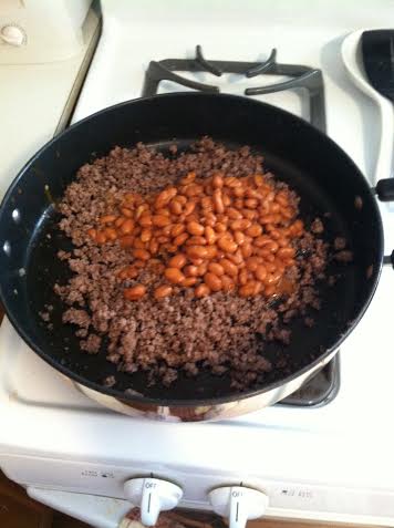 When the meat is fully cooked pour in the Chili Beans. Mix in and warm through. Once the noodles are finished you will pour them in with the meat and beans. The noodles must be added after the beans.